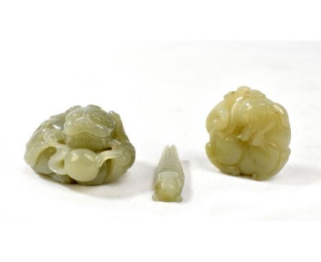 Three jade carvings comprising two Dogs of Pho, length of larger 5.5cm, and a locust/grasshopper (3).&nbsp;Additional Informa