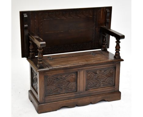 An oak monk's bench with carved floral detail, 97 x 107cm.
