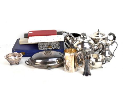 A small group of plated items including a part gadrooned tea service, cased cutlery, a mug, etc.