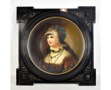 A 19th century ceramic plaque painted with portrait of a young lady in ornate dress wearing gold necklace, unsigned and with 