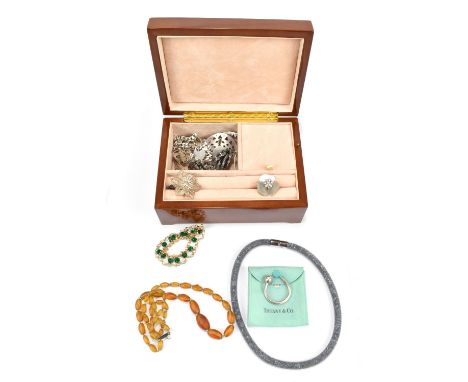 A small group of costume jewellery to include silver bracelets, a Swarovski necklace, and a Tiffany wine glass charm.