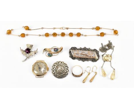 A small group of jewellery to include a 9ct yellow gold opal brooch, a 9ct yellow gold cased wristwatch, lacking strap, a yel