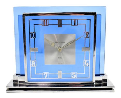 LE COULTRE; Art Deco blue glass and chrome mantel clock, the square face set with Arabic numerals, marked 'Garrard Tyme', the