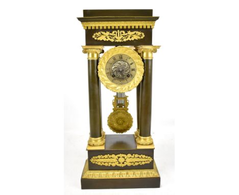 A 19th century French ormolu and patinated brass portico mantel clock, the circular dial having Roman numerals, height 54cm. 