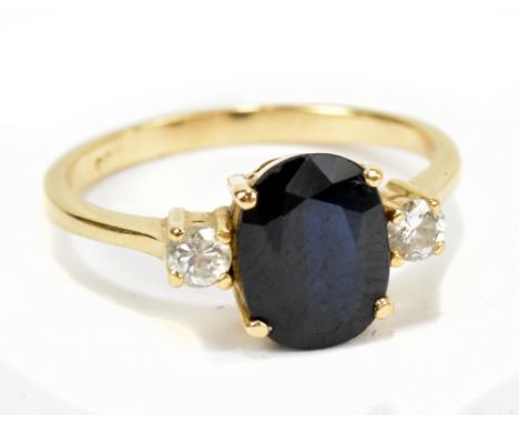 A yellow metal sapphire and diamond ring, size K, approx 2.5g.