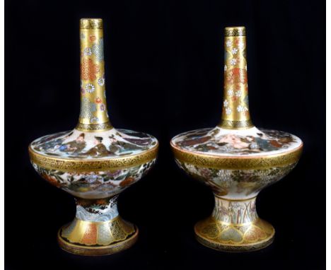 A pair of Japanese Satsuma bottle neck vases painted with figures to the upper platform of the body and with panels of birds 