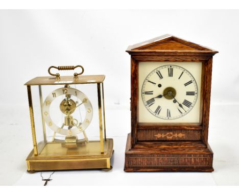 An early 20th century oak cased line inlaid mantel clock, the square dial set with Roman numerals, height 30cm, also a brass 