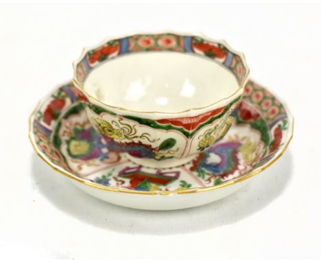 A first period Worcester fluted tea bowl and saucer decorated in the 'Dragons in Compartments' pattern, each piece imitation 