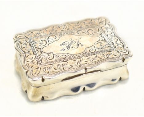 A Victorian hallmarked silver snuff box, with floral and foliate scroll decoration, with monogrammed cartouche, Birmingham 18