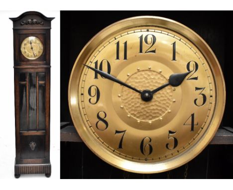 An early 20th century oak cased longcase clock having circular brass dial with Arabic numerals, height 210cm.