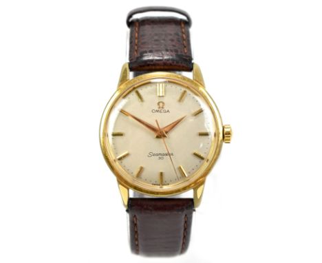 OMEGA; a gold plated 'Seamaster' gentleman's wristwatch, the silver dial set with baton numerals, with Omega leather strap, b