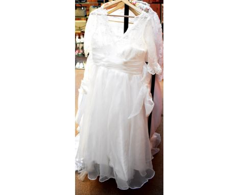 BRIDAL; a Lanting ivory lace and tulle ball gown style dress, with lace bodice, short lace sleeves and chiffon over skirt and