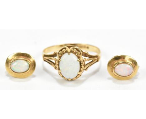 A 9ct yellow gold opal cabochon dress ring, size J/K, also a pair of 9ct yellow gold cabochon opal ear studs, combined approx