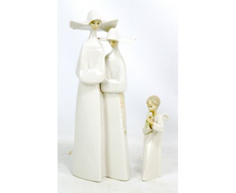 LLADRO; a figure group of two nuns, height 32.5cm, and a Nao cherub (2). Additional InformationLight surface wear and dirt, o