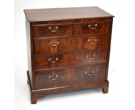 A Georgian oak straight front chest of two short over three long drawers, raised on bracket feet, length 90cm