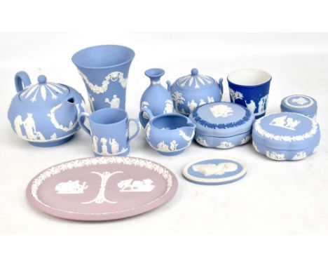 A small group of Wedgwood blue jasperware to include a teapot, a sugar bowl, a trinket dish, a vase, etc.