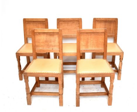 ROBERT 'MOUSEMAN' THOMPSON; a set of five light oak dining chairs, each raised on block supports.Additional InformationThese 