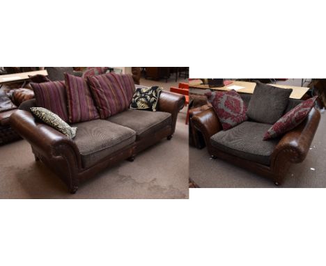 A contemporary half leather oversized two seater sofa and matching armchair.