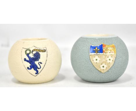 WILTSHAW &amp; ROBINSON; two Carltonware globular pottery match strikers each decorated with a shield cartouche for Cambridge