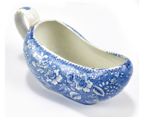 A 19th century blue and white bourdaloue, with floral decoration, length 25cm.Additional InformationCrack running along half 