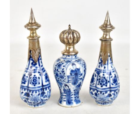 A small pair of Chinese 18th century porcelain lobed bottles/vases decorated in underglaze blue with Buddhist symbols and flo