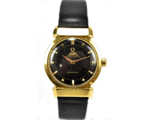 OMEGA; a yellow metal chronometer 'Seamaster' gentleman's wristwatch, the black textured dial set with baton numerals, diamet