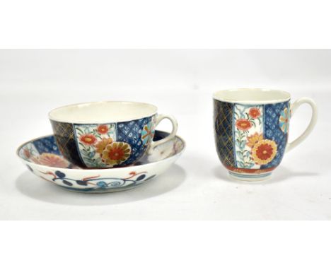 A first period Worcester tea cup and saucer and matching cup, decorated in Kakiemon and Imari pattern, in alternate panels, e