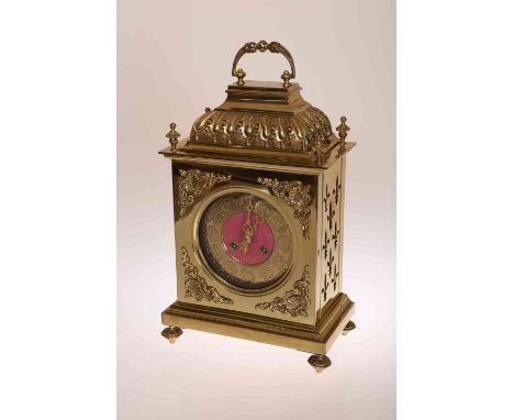 A FRENCH BRASS BRACKET CLOCK, 19TH CENTURY, the case with fleur-de-lys fret cut-outs to the dies and caddy top with carrying 