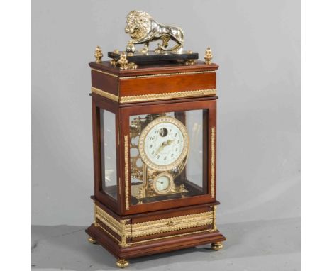 A BALL POWERED FERRIS WHEEL CLOCK, the case with silvered lion surmount, the circular dial with "jewelled" bezel, integral th