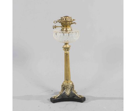 A VICTORIAN BRASS OIL LAMP, with tapering Corinthian column, raised on outswept legs with claw feet, on a polished slate base