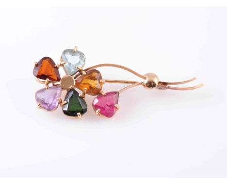 A MULTI GEM SET FLOWER BROOCH, the oval cut amethyst, garnet, aquamarine, citrine and green tourmaline each set as the five p