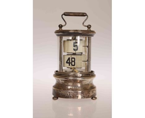 AN EDWARDIAN SILVER TICKET CLOCK, Charles S. Green, Birmingham 1905, the cylindrical case housing two sets of tickets in a re