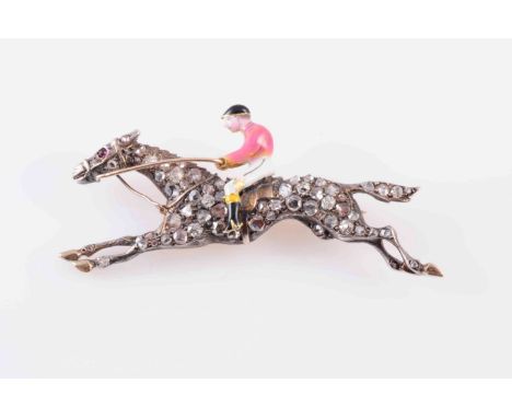 A DIAMOND SET ENAMEL HORSE AND JOCKEY BROOCH, CIRCA 1880, depicting the horse at full gallop, set throughout with graduating 