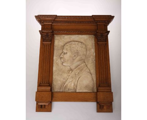 A COMPOSITION PORTRAIT PLAQUE OF SIR EDWARD ELGAR, dated 1892 and indistinctly signed P. Pandes?, in an architectural oak fra