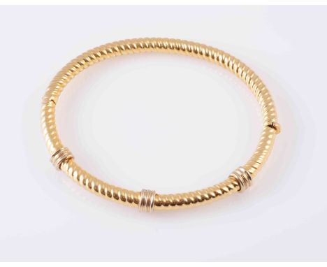 A YELLOW GOLD COLOURED BANGLE, the rope work design bangle with three moulded spacers to the upper section. Clasp marked '750