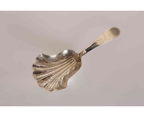 A VICTORIAN SILVER CADDY SPOON, Hilliard & Thomason, Birmingham 1864, with shell shaped bowl and bright-cut engraving. 9cm