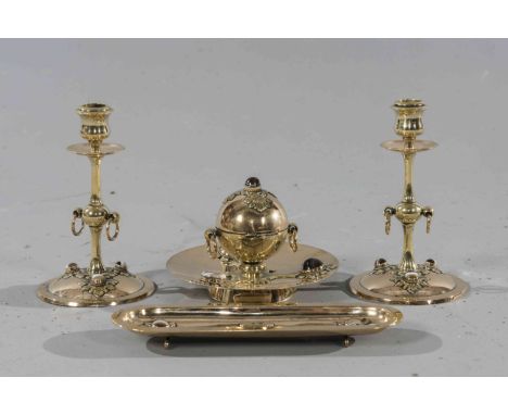 A VICTORIAN "JEWELLED" BRASS DESK SET, comprising inkwell, pair of candlesticks and pen tray, set with cabochon cut stones. C