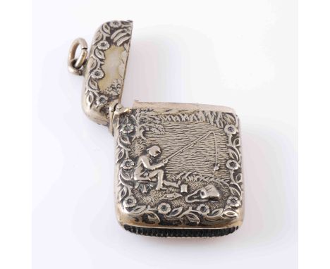 ANGLING INTEREST: A SILVER PLATED VESTA, chased with a fisherman; together with A WHITE METAL PIG PIN CUSHION. (2)