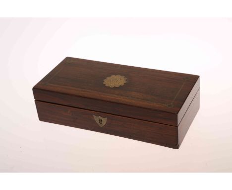 A 19TH CENTURY BRASS AND ROSEWOOD TRAVELLING PEN BOX, the interior with inkwell and covered boxes. 19cm wide