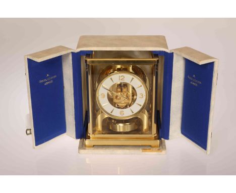 JAEGER LE COULTRE, AN ATMOS CLOCK, no. 141997, the brass case housing a skeletonised movement with circular chapter, cased wi