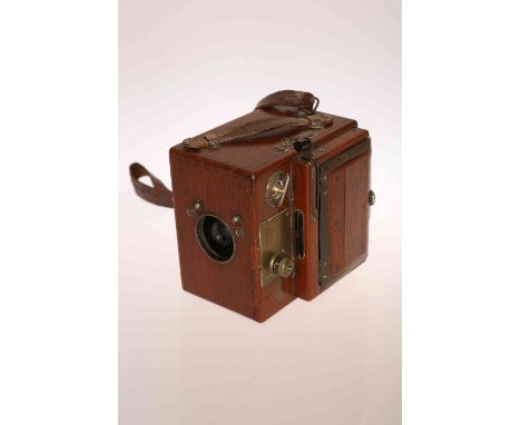 HOUGHTON BUTCHER, AN ENSIGN ROLL FILM REFLEX TROPICAL MODEL CAMERA, teak and brass mounted.