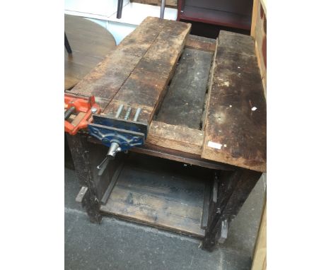 A WORK BENCH WITH TWO VICE