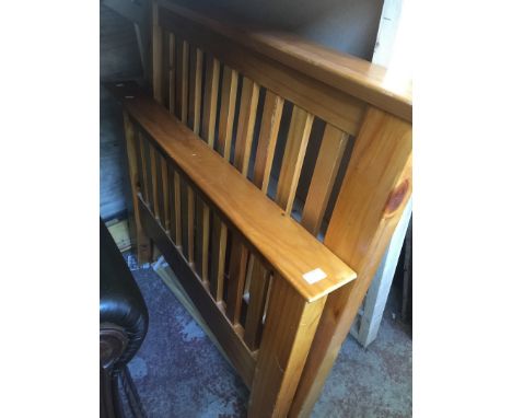 A LIGHT WOOD SINGLE BED FRAME