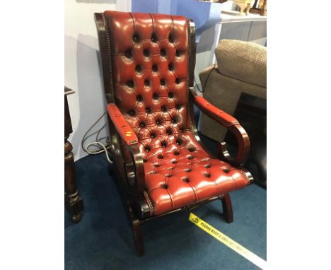 A burgundy Chesterfield button back armchair