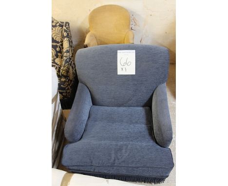 A blue upholstered sold back loose cushion deep armchair front castors 600mm x 810mm