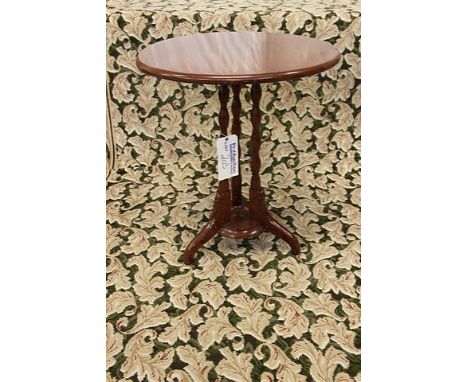 A mahogany circular table 615mm diameter mounted on three carved turned pedestals centre stretcher tripod legs 770mm 