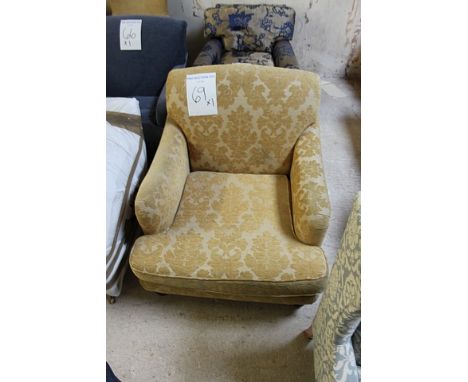 A gold upholstered arm chair solid back loose cushion mahogany framed 700mm x 830mm 