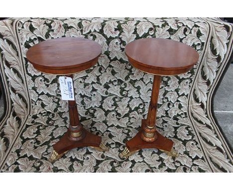 A  pair of mahogany and gilded lamp tables single carved acanthus pedestal on triform base with claw foot 400mm diameter 