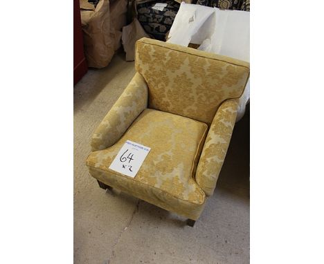 A pair of gold upholstered arm chairs with solid back with loose cushion front castor 600mm x 820mm