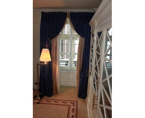 A pair of luxury lined blue curtains with decorated edge tasselling 2300mm drop